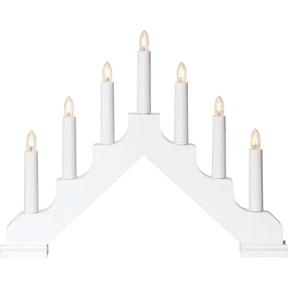 The Star Trading Ada is a white, electric 7-light candelabra with candles arranged in a stepped, triangular pattern.
