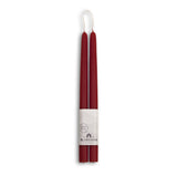 Bluecorn Beeswax offers eco-friendly, dripless taper candles; two 10-inch red beeswax candles paired in a bundle with a white brand label at the base, merging elegance and sustainability for any setting.