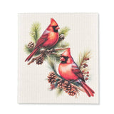 The Swedish Dish Cloth: Cardinals & Pine Cones Dishcloth features red cardinals on pine branches with pinecones and berries, making this biodegradable cloth a festive and eco-friendly choice for your home cleaning needs.