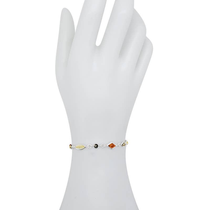 A white mannequin hand elegantly showcases the Marquise Shaped Multi-Color 13 Amber Stones Set in Sterling Silver Link Bracelet.