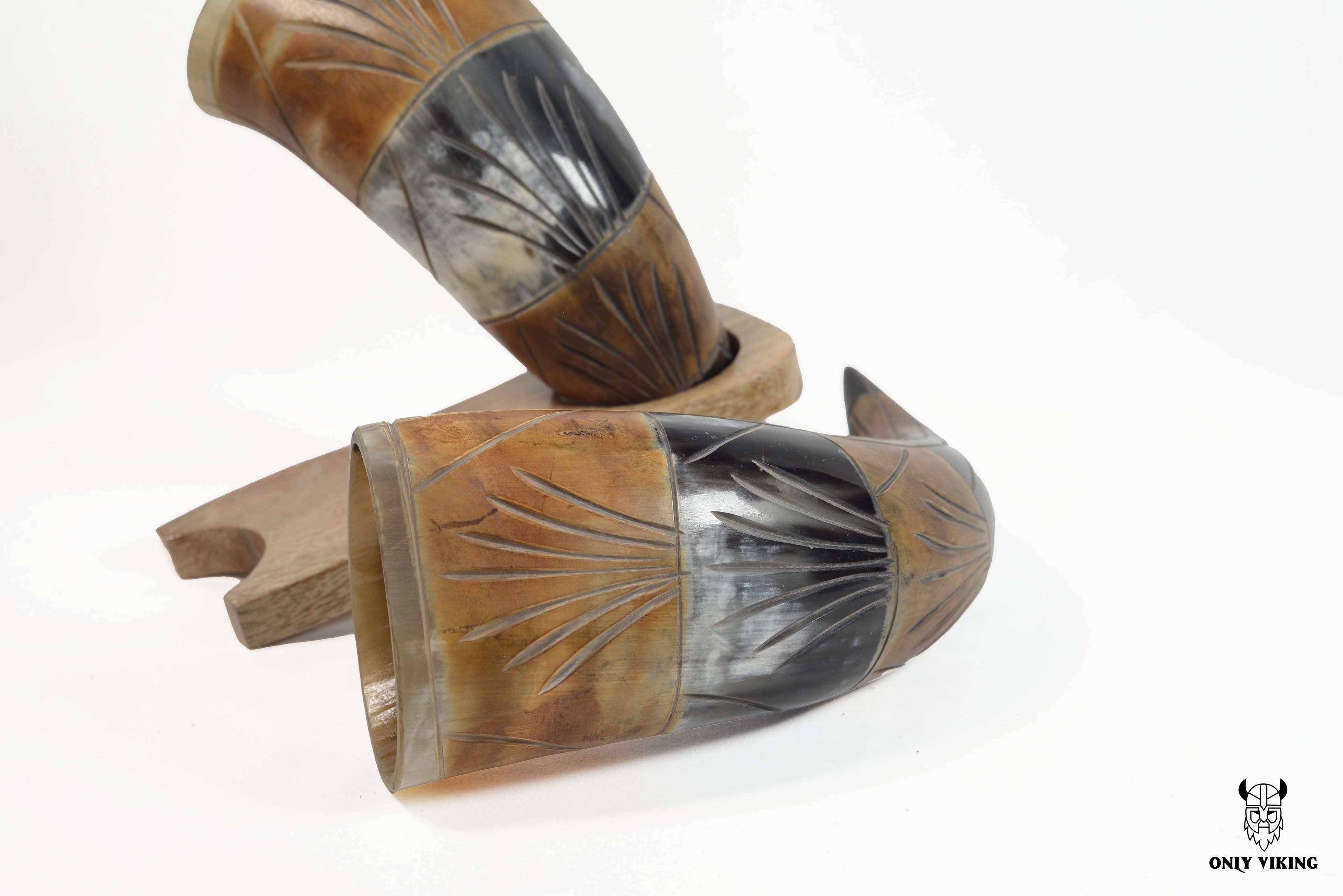Two “Black & Brown Viking Drinking Horns” with traditional engraved designs and wooden stands are shown on a white background. The "Only Viking" logo appears bottom right. Crafted from authentic ox horn for a genuine drinking experience.