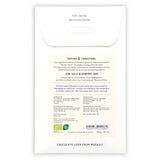 Back of a Fjak Milk Chocolate Bar with Wild Blueberry 50% (Nordic Collection) package, featuring product details, ingredients, barcode, company info; highlights Norwegian chocolate made with wild blueberries and premium organic cocoa beans.
