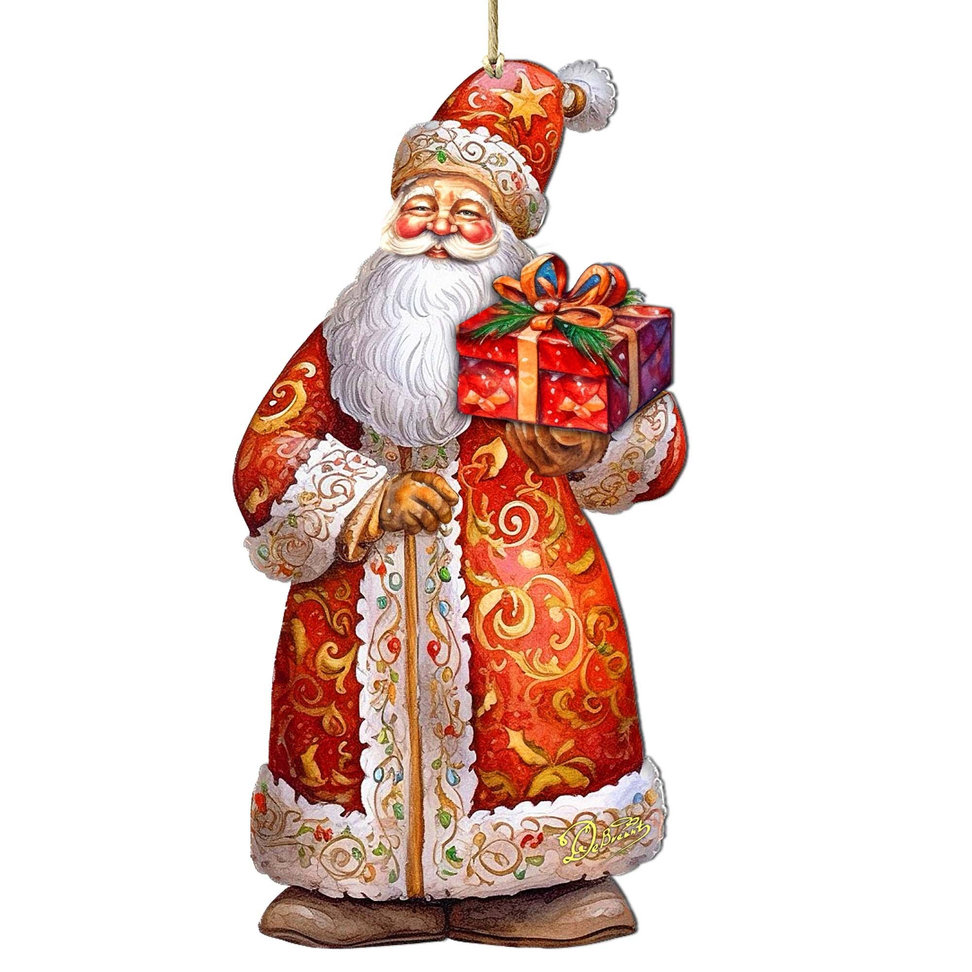 Introducing the "St. Nick's Gift Wood Ornaments" from GDebrekht featuring a festive Santa Claus donned in a red and gold robe, elegantly holding a wrapped gift—ideal for enhancing your Christmas holiday decor.