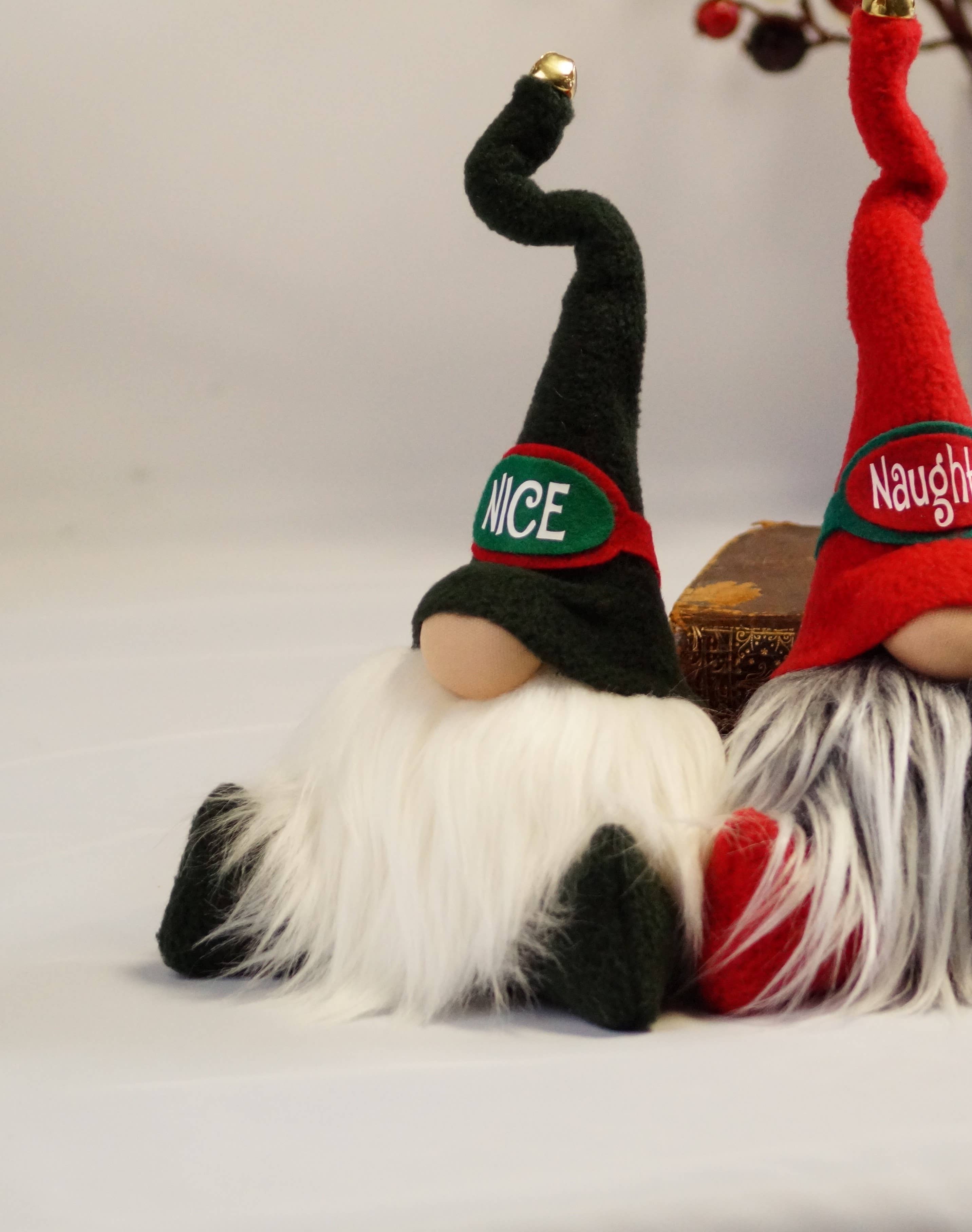 Sitting side by side, one with a Nice hat and the other with a Naughty hat, these two holiday gnomes proudly showcase their long beards and pointy hats. The handmade Nice Christmas Gnome brings whimsical charm to your festive décor, embodying the cheerful spirit of the season.