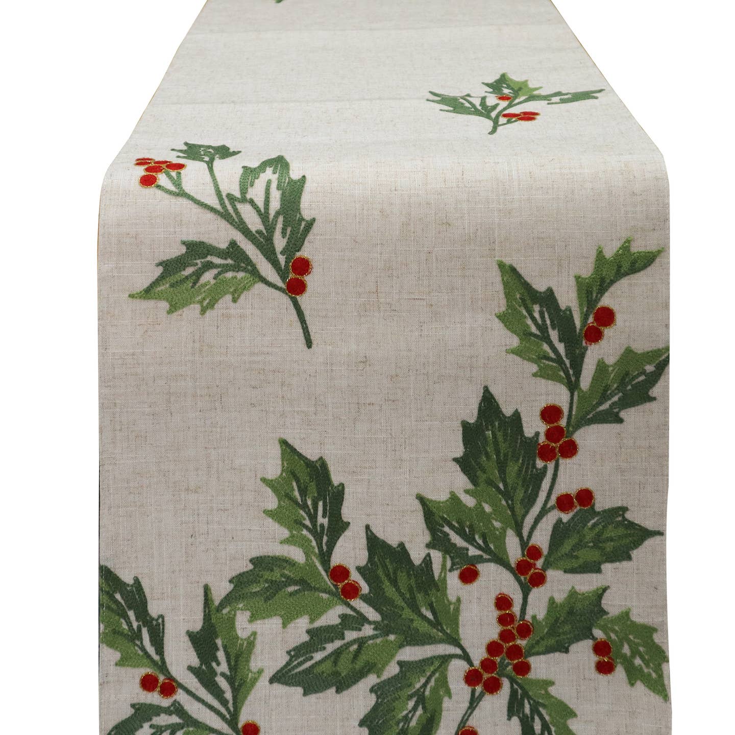 The Runner: Happy Holly Table Runner is a beige holiday runner with green holly leaves and red berries, ideal for Christmas decor.