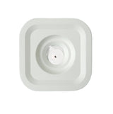 A square, white Stumpastaken Ettan candle holder (8.8x8.8x4 cm) in 100% recycled material, viewed from above, with clean lines and sustainable Scandinavian design echoing the simplicity of a central sensor pad.