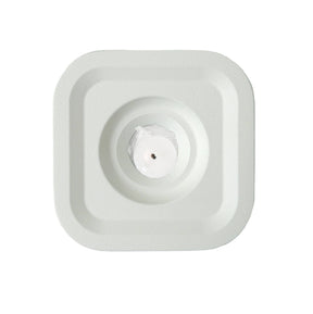 A square, white Stumpastaken Ettan candle holder (8.8x8.8x4 cm) in 100% recycled material, viewed from above, with clean lines and sustainable Scandinavian design echoing the simplicity of a central sensor pad.