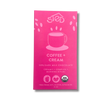 Bright pink chocolate bar wrapper with a coffee cup illustration and USDA Organic label, text indicating organic dark milk chocolate with Ethiopian coffee.