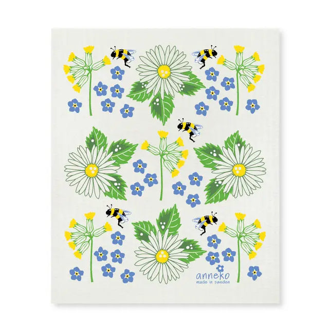 The Dish Cloth: Swedish Summer Flowers by Anneko Design Sweden features daisies, forget-me-nots, yellow blooms, and bees on white with “anneko made in Sweden” at the bottom—a lovely, eco-friendly, and practical addition to your kitchen.