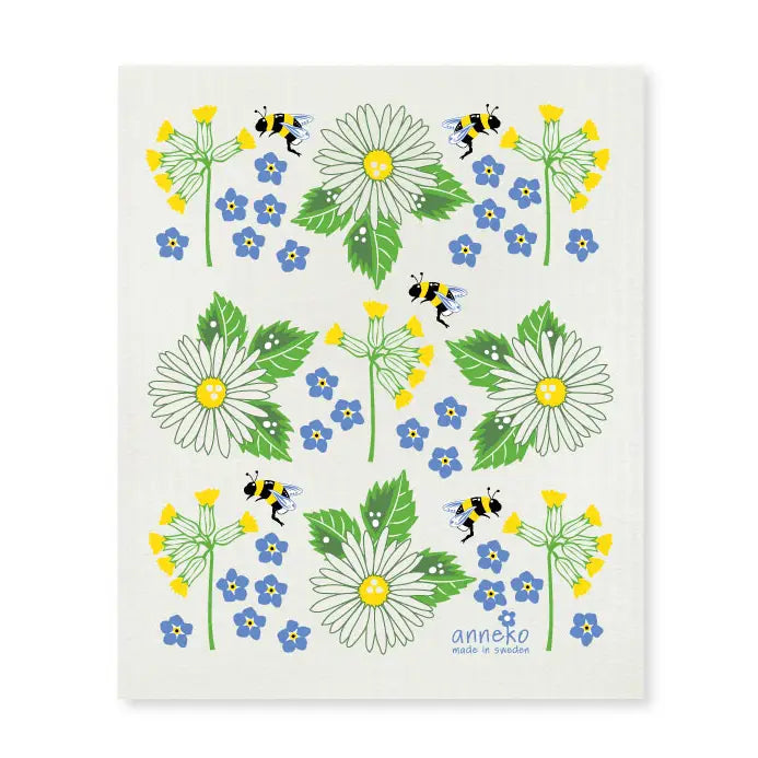 Experience the charm of Swedish Summer Flowers with this eco-friendly, biodegradable dishcloth featuring daisies, blue blossoms, green leaves, and playful bees on a crisp white background.