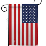The United States of America Garden Flag – USA Nationality Home Decor Flag hangs vertically on a black metal pole holder, proudly displaying American pride with classic stars and stripes.