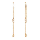 Earrings: A&C Oslo Long Crystal Chain Gold Earrings feature clear round gemstones and delicate gold chains with small dangling elements for a refined, organic look.