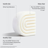 The Hair: Rice Water Shampoo & Conditioner Bar Combo for Hair Growth by Kitsch features curved white bars with a white tea and mandarin scent, using Rice Tein NPNF to promote shine and support healthy hair growth.