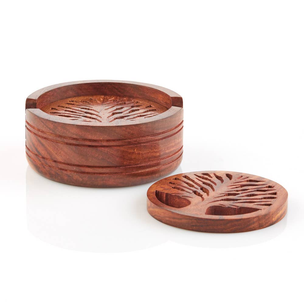 The handcrafted round wooden box, featuring a Tree of Life design carved on the lid and displayed open with the lid beside it, is perfect for storing your cherished trinkets or beloved Coaster: Tree of Life Handcrafted Wood Coasters with Holder – Set of 4.