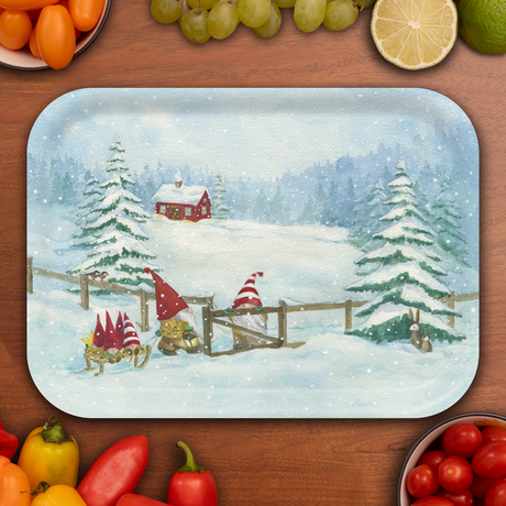Birchwood tray featuring a snowy scene with gnomes in red hats by a fence, pine trees, red house, rabbit, and assorted fruit and vegetables around the edge.