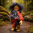 The Marketplace24 Troll: Borin Blackruff Troll Witch stands 8" tall with wild black hair, a big nose, and pointed ears. Dressed in red and black, it grins among forest rocks—perfect décor for Scandinavian folklore fans.