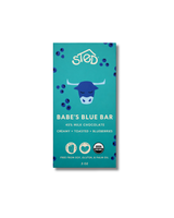 Blue chocolate bar wrapper with blue cow illustration, wild blueberries, text stating 45% milk chocolate, creamy, toasted, and visible certification icons.