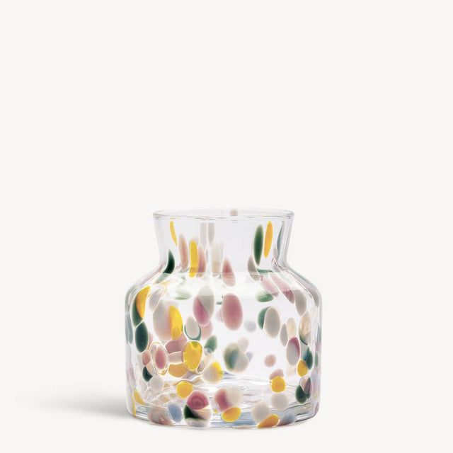 Clear glass vase with a flared rim and colorful, confetti-like spots.