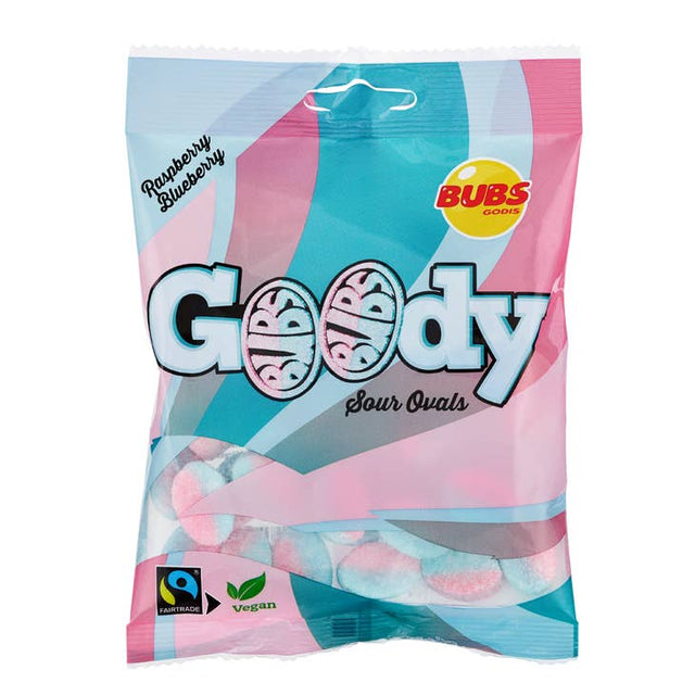 A bag of Bubs Sour Raspberry & Blueberry candy (90g) is packed with tangy raspberry and blueberry flavors, using Fairtrade sugar and free from gelatin, showcasing both the Fairtrade and Vegan logos.