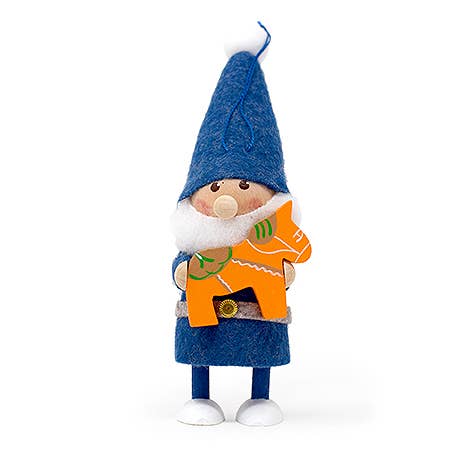 A Santa Gnome figurine dressed in a blue outfit and hat cradles an orange Swedish Dala horse.