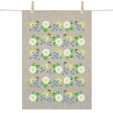 The Tea Towel: Swedish Summer Flowers Tea Towel by Anneko Design Sweden hangs on a line, displaying cheerful white daisies, yellow and blue summer flowers, green leaves, and small bees.