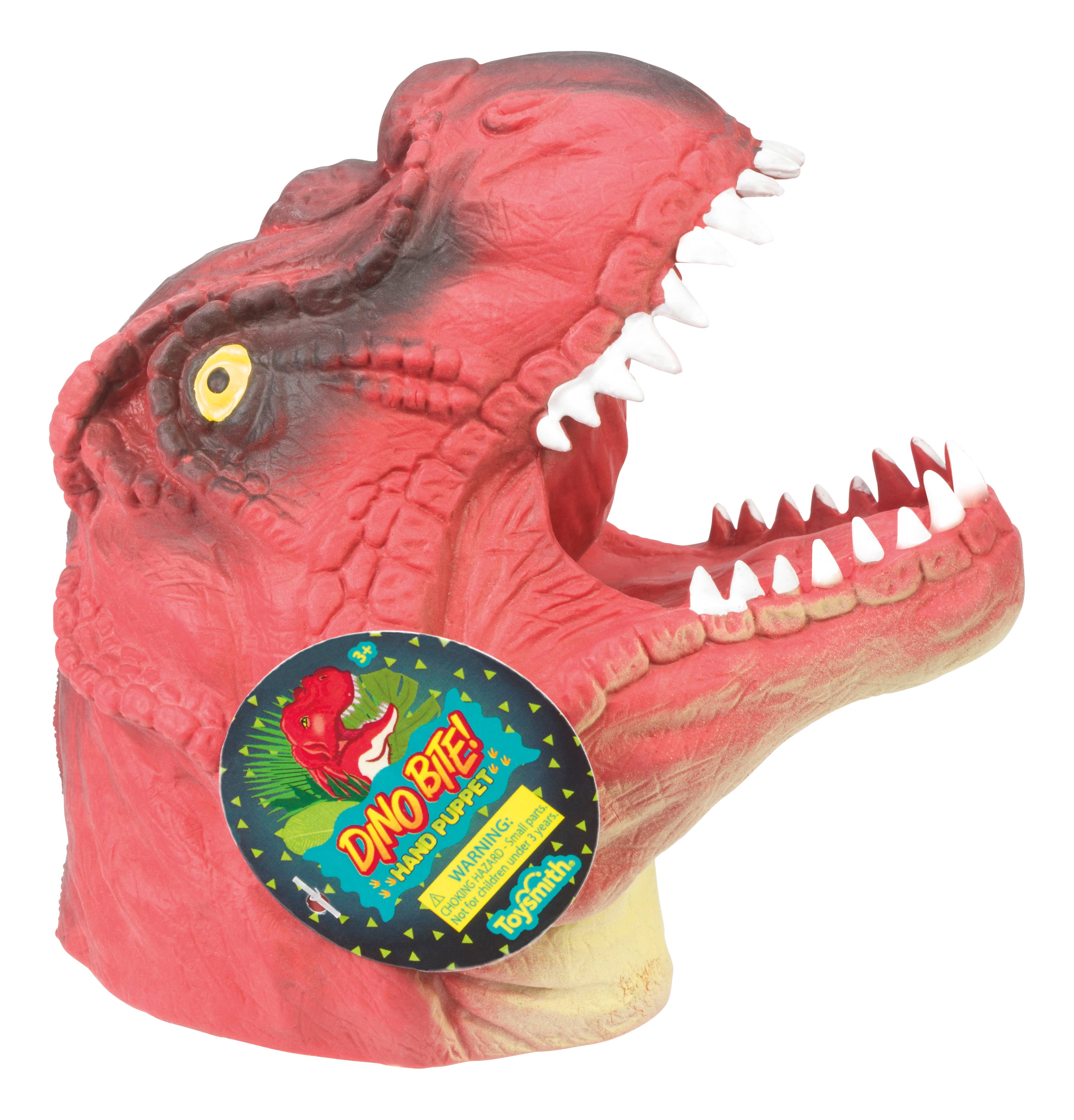 The Toy: Dino Bite! Hand Puppet in assorted colors features a vibrant T-rex design with sharp teeth and a playful label reading "Dino Bite!" Ideal for imaginative play, this red dinosaur toy is sure to captivate both children and collectors.