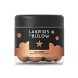 A 125g jar of Lakrids by Bülow Classic Caramel—Danish chocolate-coated licorice—offers a delicious gluten-free treat in labeled packaging with a black lid.