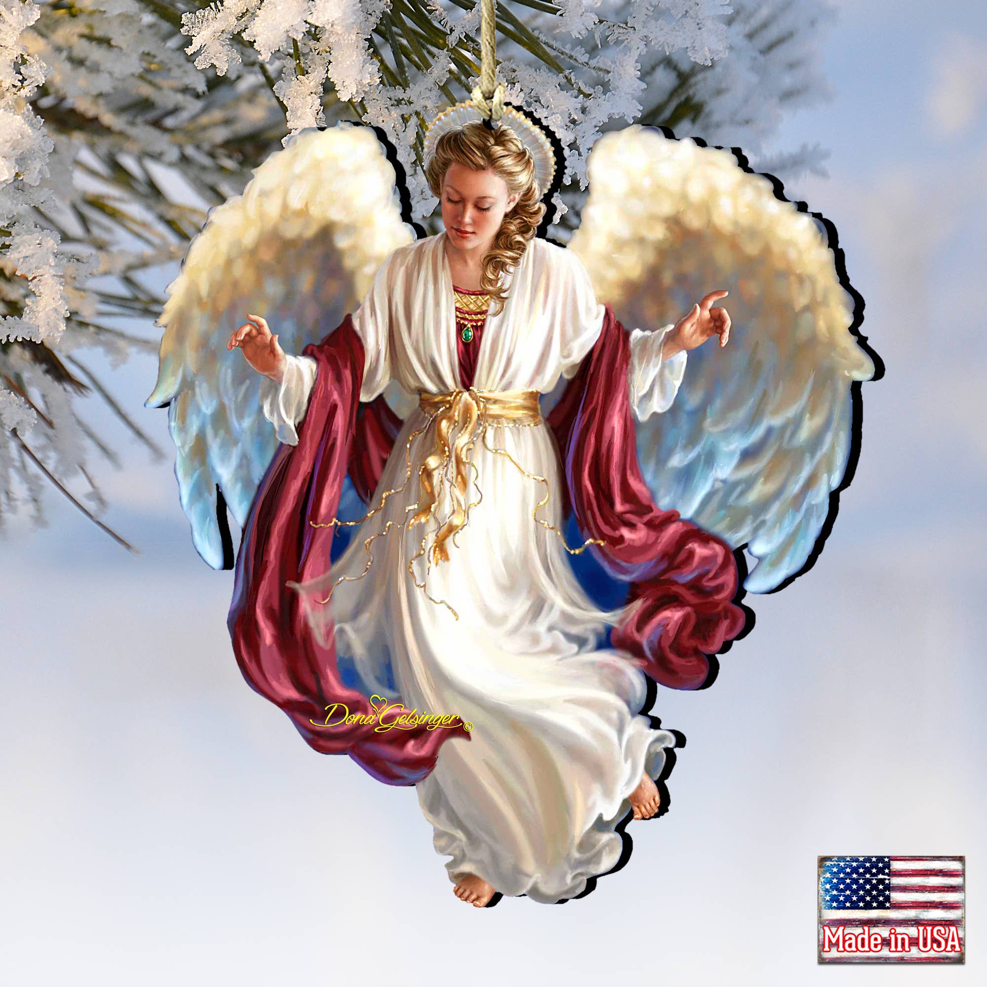 The "Peace on Earth Angel" wood ornament by Dona Gelsinger showcases a beautifully handcrafted angel in flowing robes with outstretched arms, surrounded by snowy branches. Ideal for your holiday gallery, it proudly displays a Made in USA label.