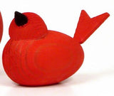 The "Figurine: Wooden Scandi Birds" is a red, handmade abstract bird sculpture from Sweden with a black beak and simplified features.