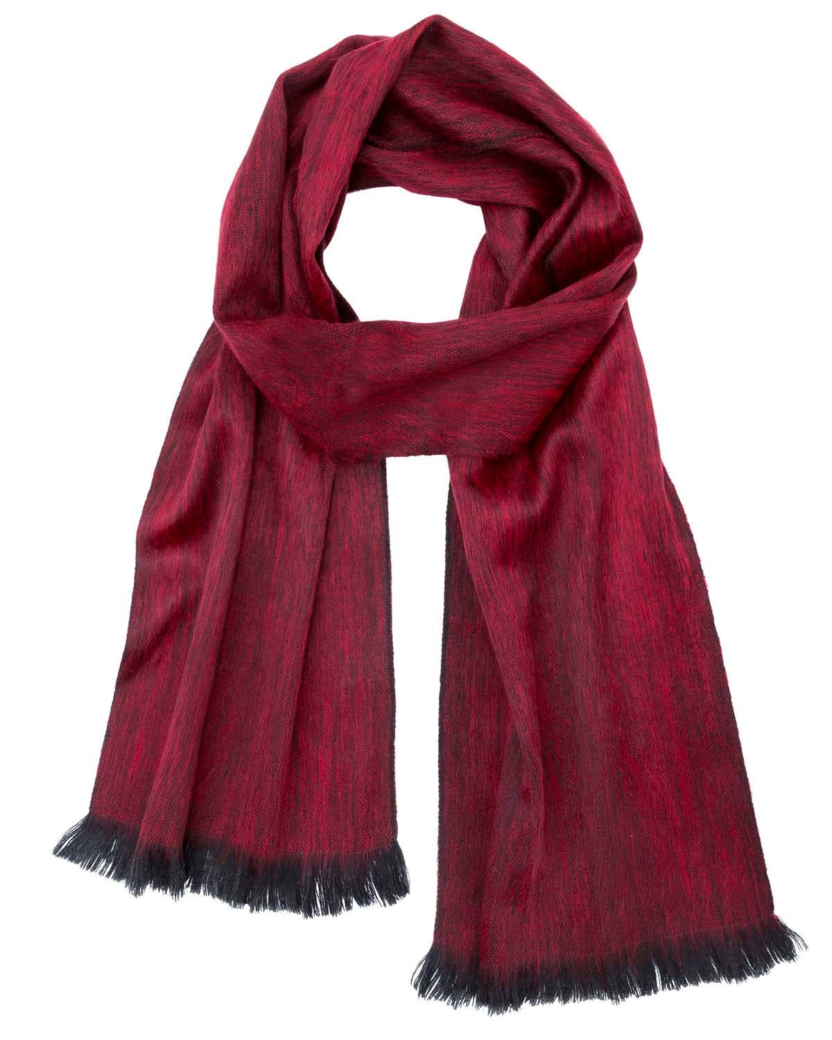 The Alpaca Scarf in sapphire red features black fringe and is displayed laid flat on a white background.
