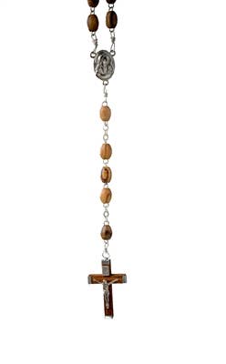 Crafted from olive wood, the Olive Wood Rosary with Crucifix and water from Jordan showcases wooden beads, a metal medallion, and a crucifix at its conclusion.