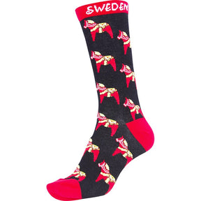 The Socks: Frost Scandinavian Youth Socks feature a black base with red heel and toe, highlighted by vibrant yellow and red Dala Horse designs. SWEDEN is elegantly printed in white at the top, making them ideal Scandinavian childrens socks.