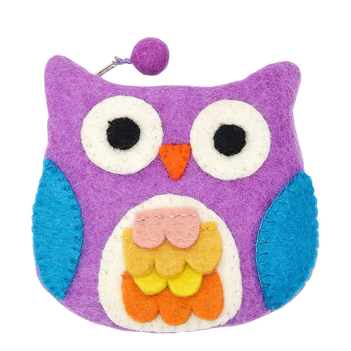 The Bag: Blue Owl with Felt Fur Design Coin Purse is handmade in Nepal, featuring purple felt, large eyes, a small orange beak, blue wings, and colorful layered felt feathers on its belly.