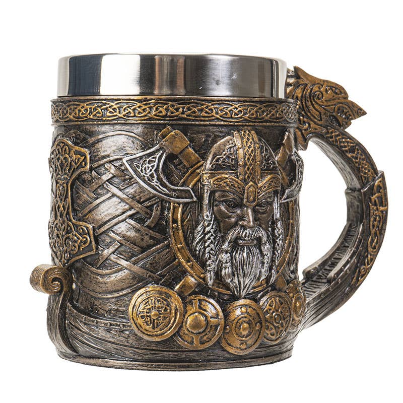 This Coffee Mug features a Viking ship design with a dragon head handle, Thor's Hammer, shields, and Viking motifs—a perfect novelty gift with ornate and metallic finishes.