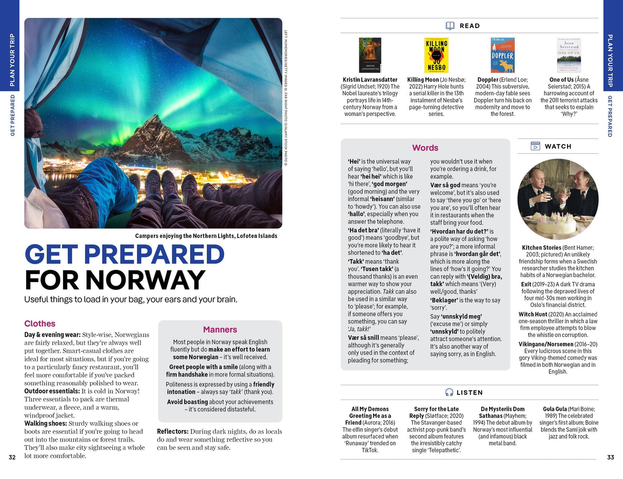A group of campers sits by tents under the Northern Lights in the Lofoten Islands, with vivid green and blue auroras illuminating snowy mountains and pine trees—a scene you can discover more about in “Lonely Planet Norway Northern Lights Safari Far North Hiking & Skiing Oslo Walking Tours Travel Guide Paperback” by Hachette Book Group.