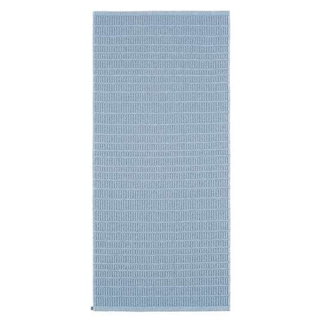 A Swedish-inspired blue rectangular yoga mat, crafted from a durable cotton/vinyl blend with a subtle textured pattern, is the Cotton/Vinyl Rug: Horredsmattan - Plastic Mai Blue 70x150cm.