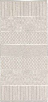 Rug: Mixed Alice - Sand features a sophisticated design with beige and cream colors, showcasing geometric patterns in alternating horizontal stripes. It's crafted from a blend of cotton and Swedish vinyl, making it suitable for both indoor and outdoor use while allowing for easy maintenance.