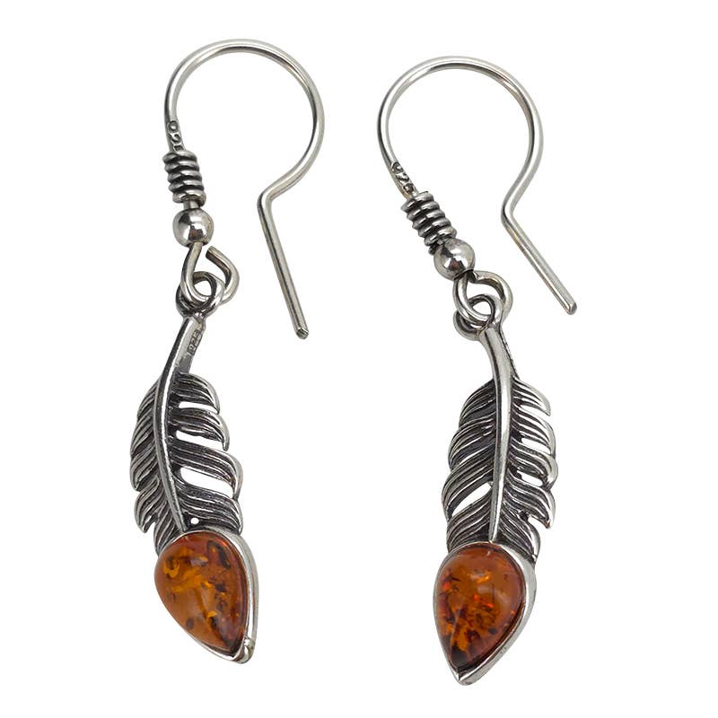 Amber Sterling Silver Feather Earrings on hooks, featuring Baltic amber-colored stone accents at the base, are displayed against a white background.