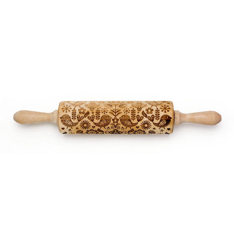 The Birds & Flowers Embossing Rolling Pin, featuring intricate floral and avian engravings on a wooden surface, makes for exquisite handmade gifts and exemplifies elegant Scandinavian design.
