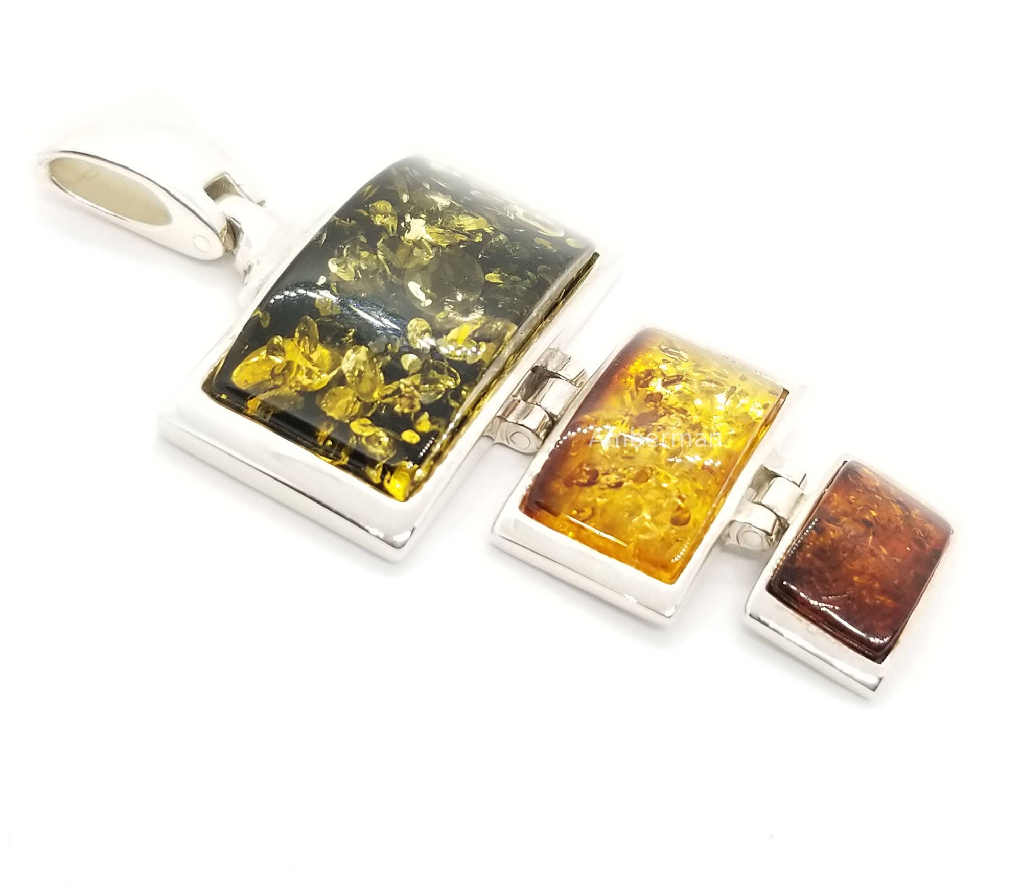 Sterling silver pendant with genuine Baltic amber showcasing green, yellow, and brown stones.