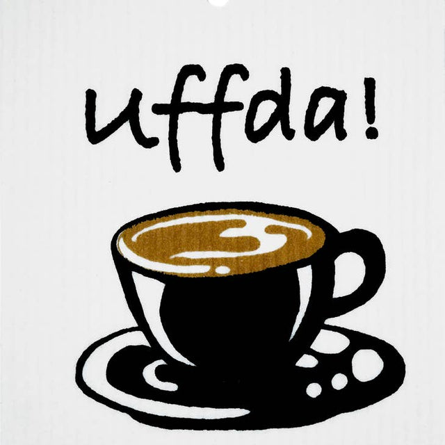 The Uffda Coffee Swedish Dish Cloth features an illustration of a coffee cup on a saucer, with uffda! above it, crafted from biodegradable materials for an eco-friendly touch.