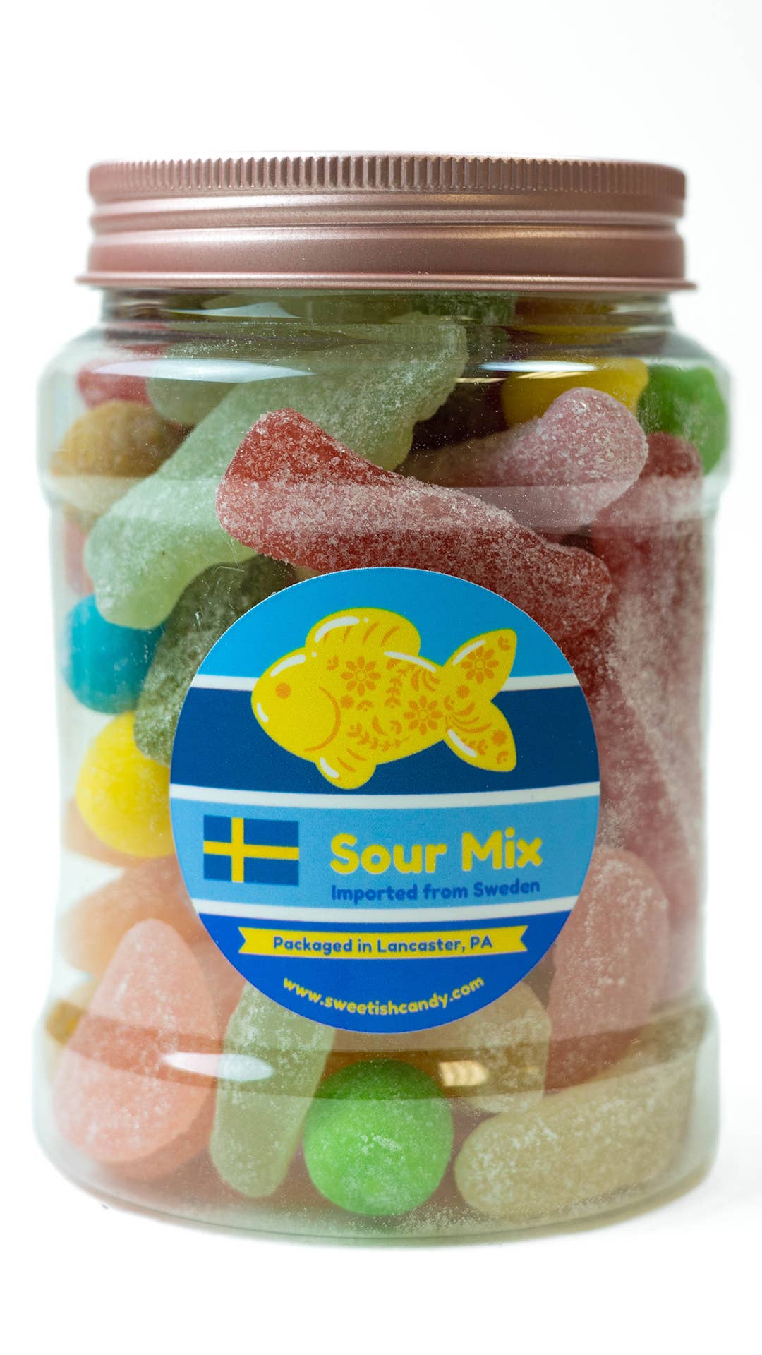 A 16oz jar of vibrant sour candies labeled Candy: Sweetish Sour Mix, adorned with a fish logo and finished with a stylish rose gold lid, imported from Sweden and beautifully packaged in Lancaster, PA.