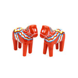 The Red Swedish Dala Horse Salt and Pepper Shakers feature two red horses with colorful patterns on a white background, capturing the essence of Swedish charm and Scandinavian heritage.