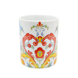 The Mug: Colorful Norwegian Rosemaling Coffee Mug 12 oz features a white ceramic base with vibrant red, yellow, blue, and green floral scroll patterns—an ideal Nordic-inspired gift.
