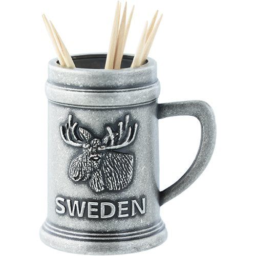 The Toothpick Holder: Sweden Mug with Moose is a silver metal toothpick holder designed like a mug, showcasing an embossed moose and the word "Sweden.
