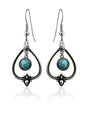 Handcrafted sterling silver earrings with teardrop frames and round turquoise stones—perfect for those who love Sterling Silver with Turquoise Drop Earrings.