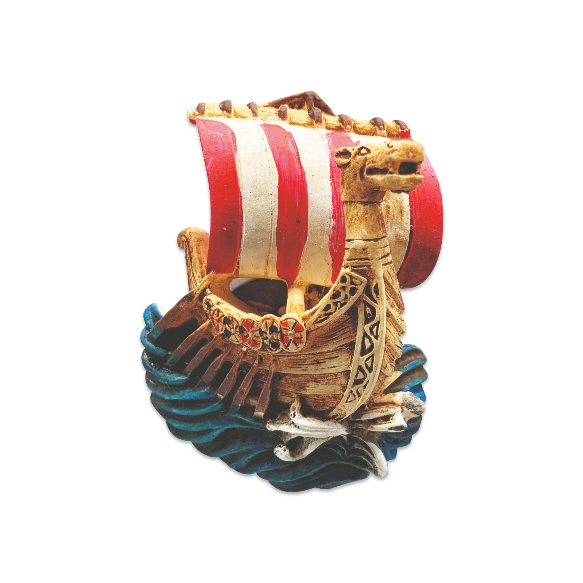 The Magnet: Viking Ship 3-Dimensional Refrigerator Magnet showcases a red and white sail, dragon prow, and vivid oars on blue waves—ideal as a Nordic-inspired gift or for adding Scandinavian decor flair to your fridge.