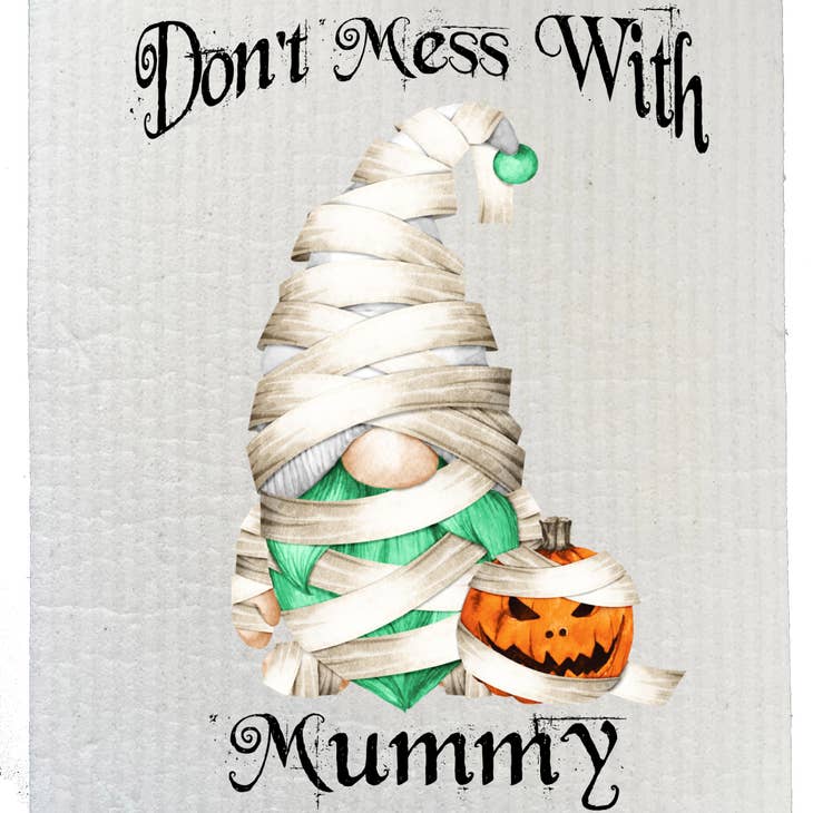 A dish cloth featuring a gnome dressed as a mummy, accompanied by a pumpkin and the words "Don't Mess With Mummy" for an eco-friendly Halloween touch.