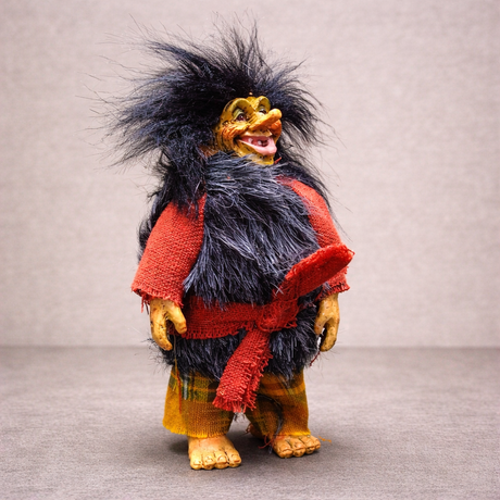 Marketplace24’s Troll: Borin Blackruff — an 8" handcrafted Scandinavian troll witch figurine with wild black hair, furry vest, red belted shirt, and yellow plaid pants—makes a charming piece of Nordic folklore decor.