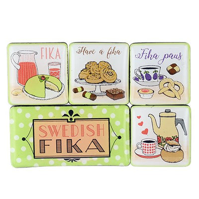The Magnet: Swedish FIKA 5 Magnets in a Plastic Case features charming illustrations of Swedish FIKA drinks and pastries with playful text. Imported from Sweden, these square magnets add a touch of Scandinavian charm to your kitchen.